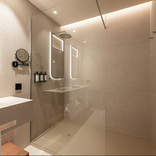 Espacio de ducha moderno con azulejos de terrazo y tocador elegante. Port Hotels: Corporativa