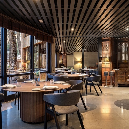 a restaurant with a lot of tables and chairs