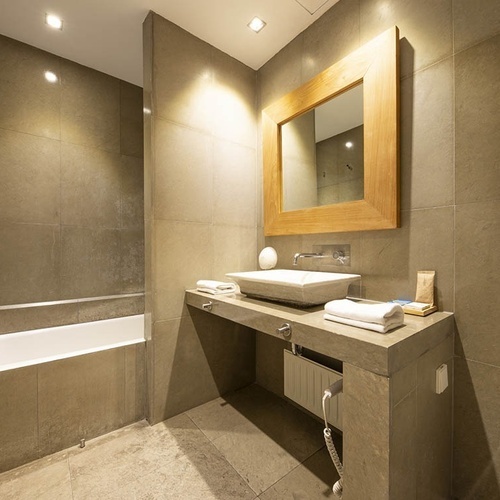 a bathroom with two sinks and a mirror