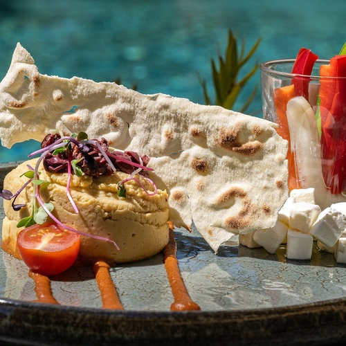 a plate of food with a piece of bread on top
