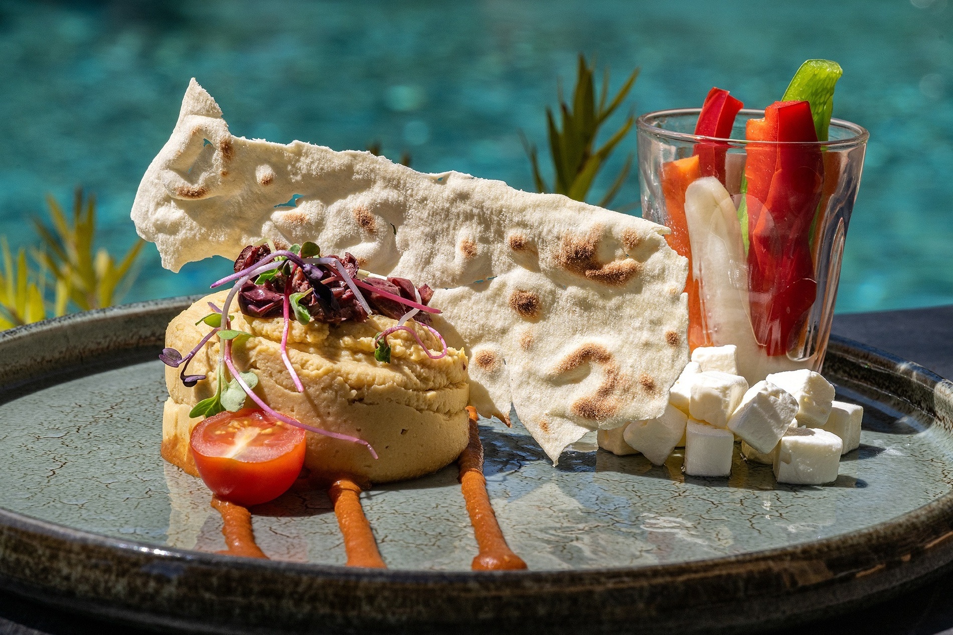 a plate of food with a piece of bread on top
