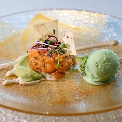 a plate of food with a scoop of green ice cream
