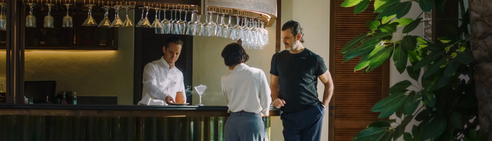 a large swimming pool in front of a hotel