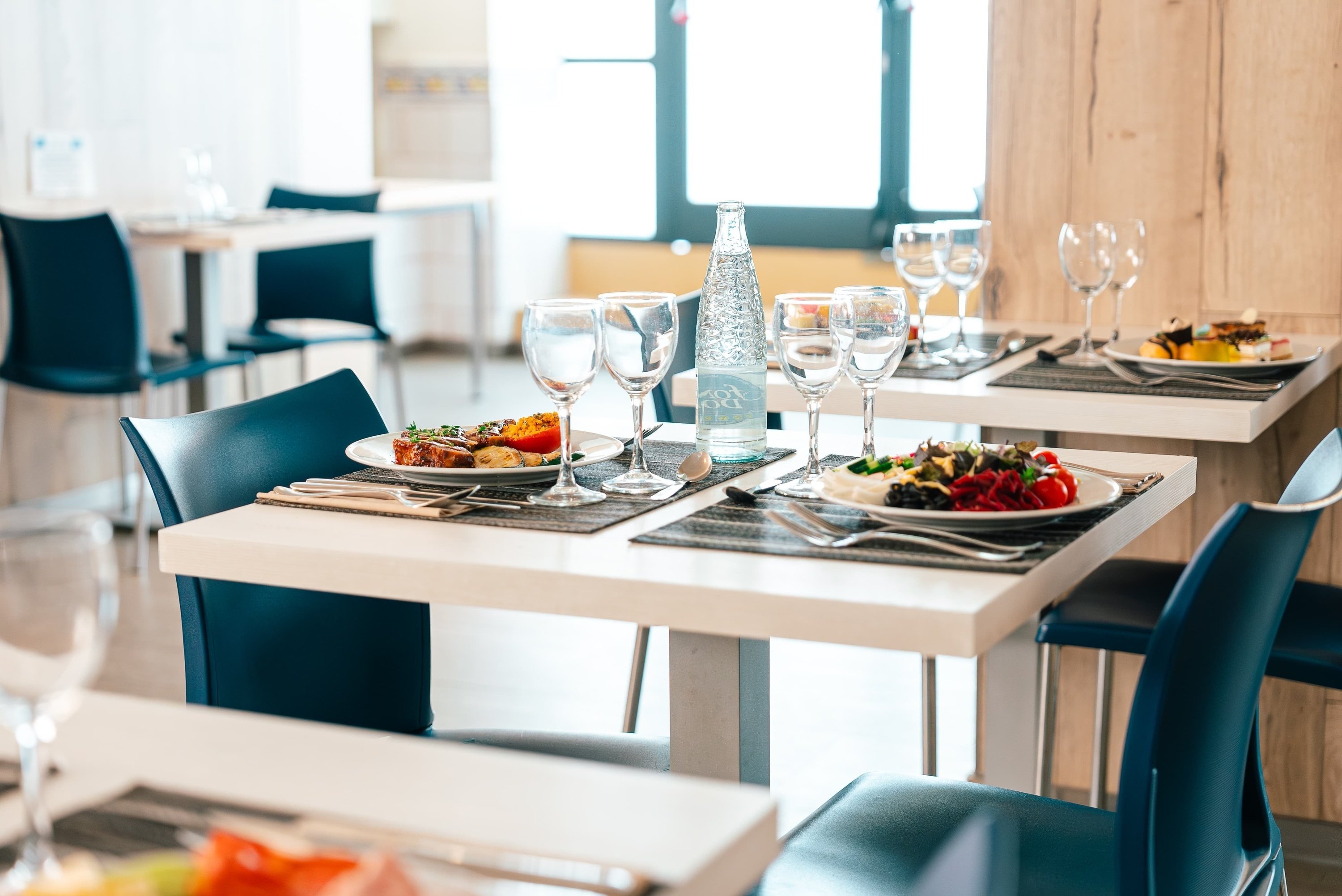 a bottle of aquafina water sits on a table