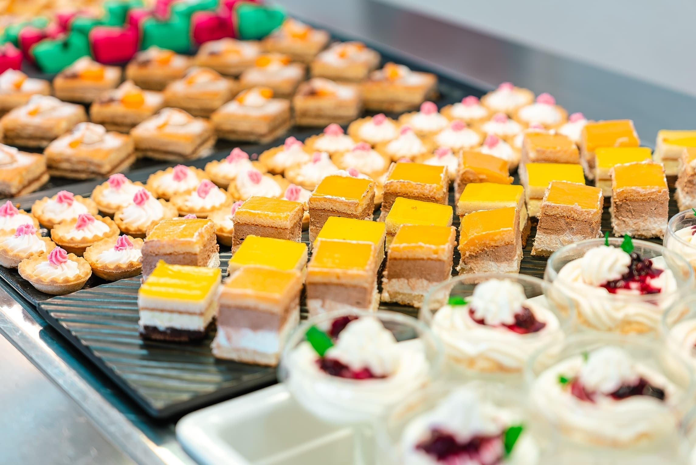 a variety of desserts are displayed on a table