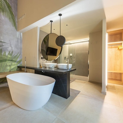 a bathroom with two sinks and a bathtub