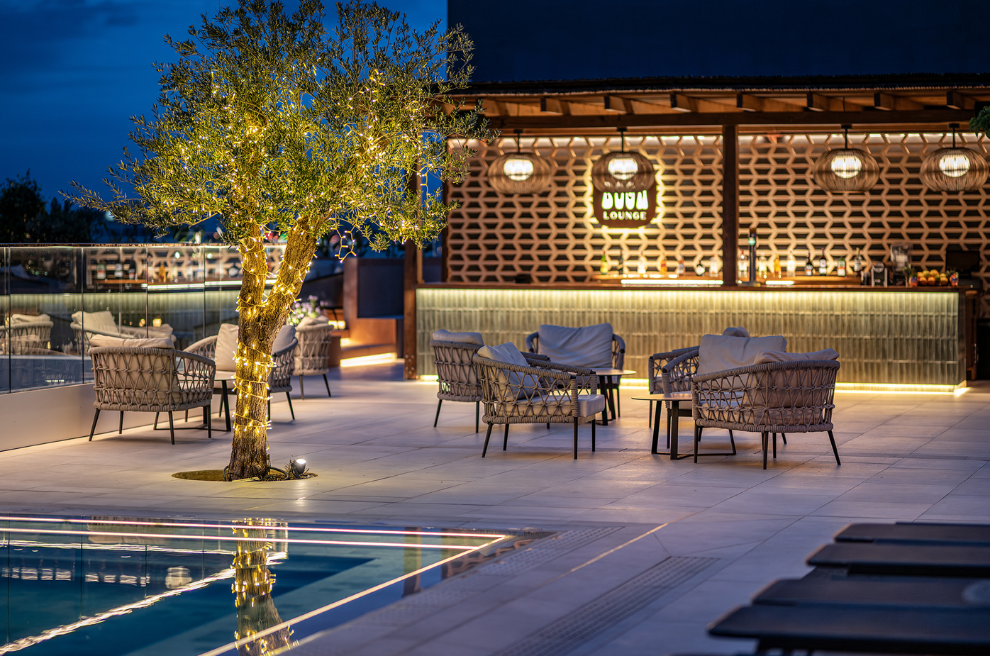 a bar with a sign that says dubai lounge