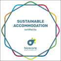 a logo for sustainable accommodation certified by bioscore