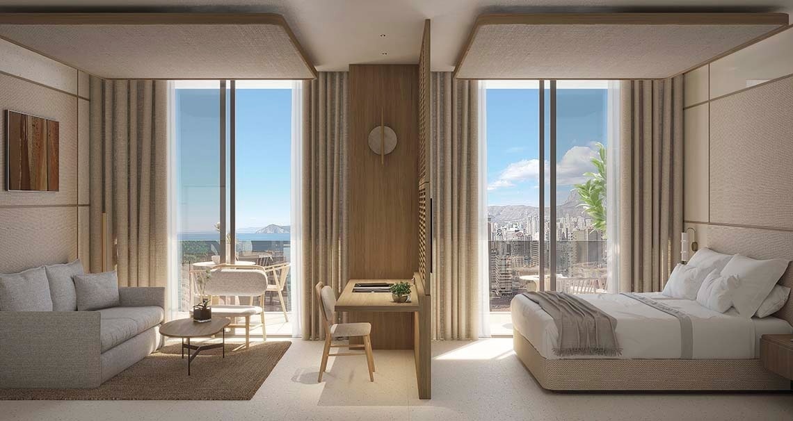 una habitación de hotel con una cama y un escritorio