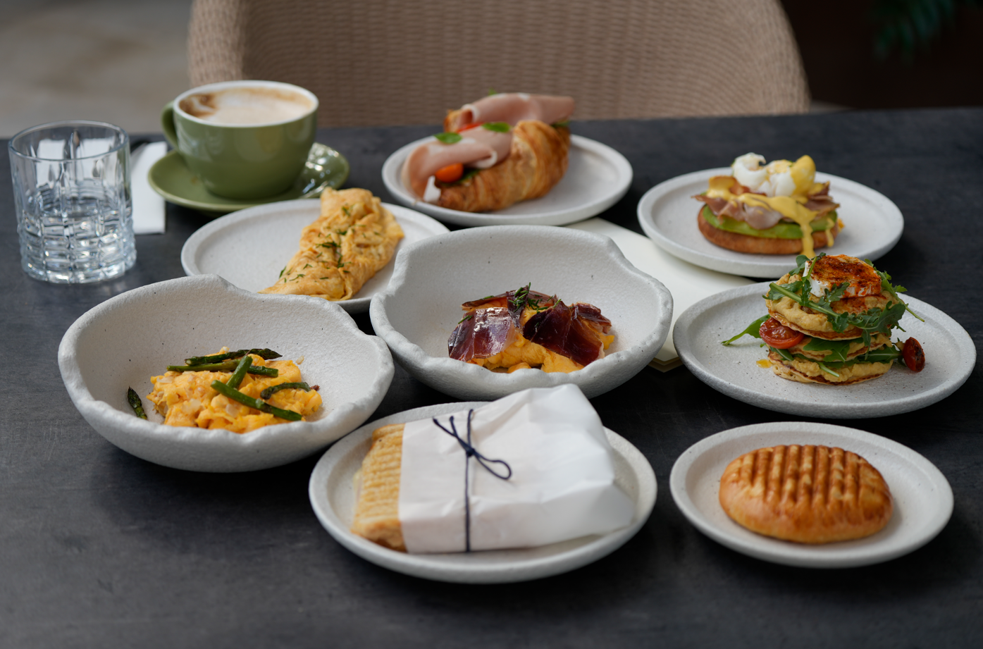 a woman is giving a man a massage in a room with candles