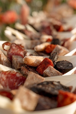 a close up of a plate of food with meat and bread - 