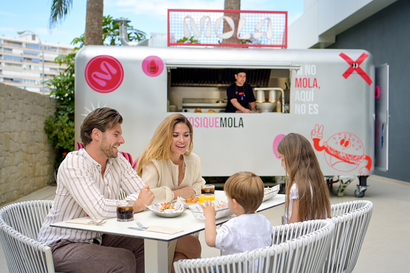 a fried chicken sandwich is sitting on a paper that says mola