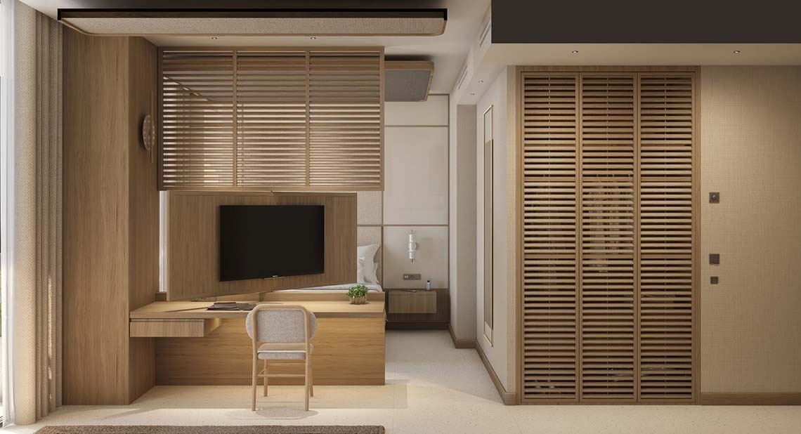 una habitación de hotel con un escritorio y una televisión