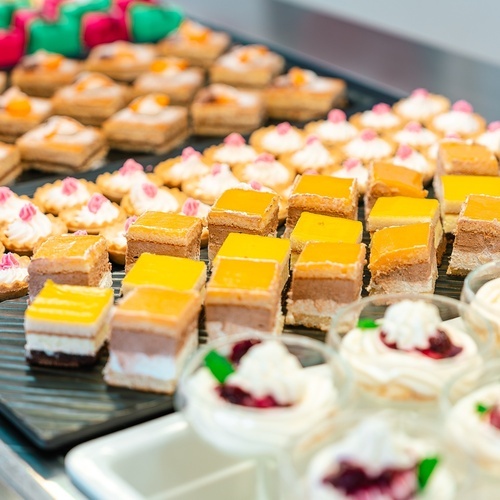 a variety of desserts are displayed on a table