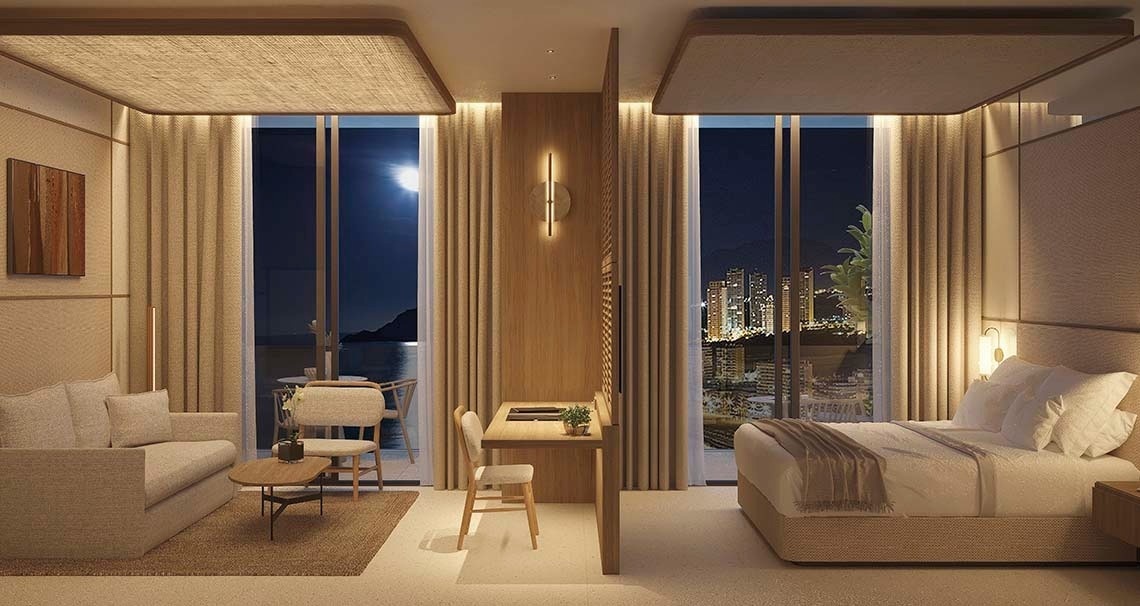 una habitación de hotel con una cama y un escritorio