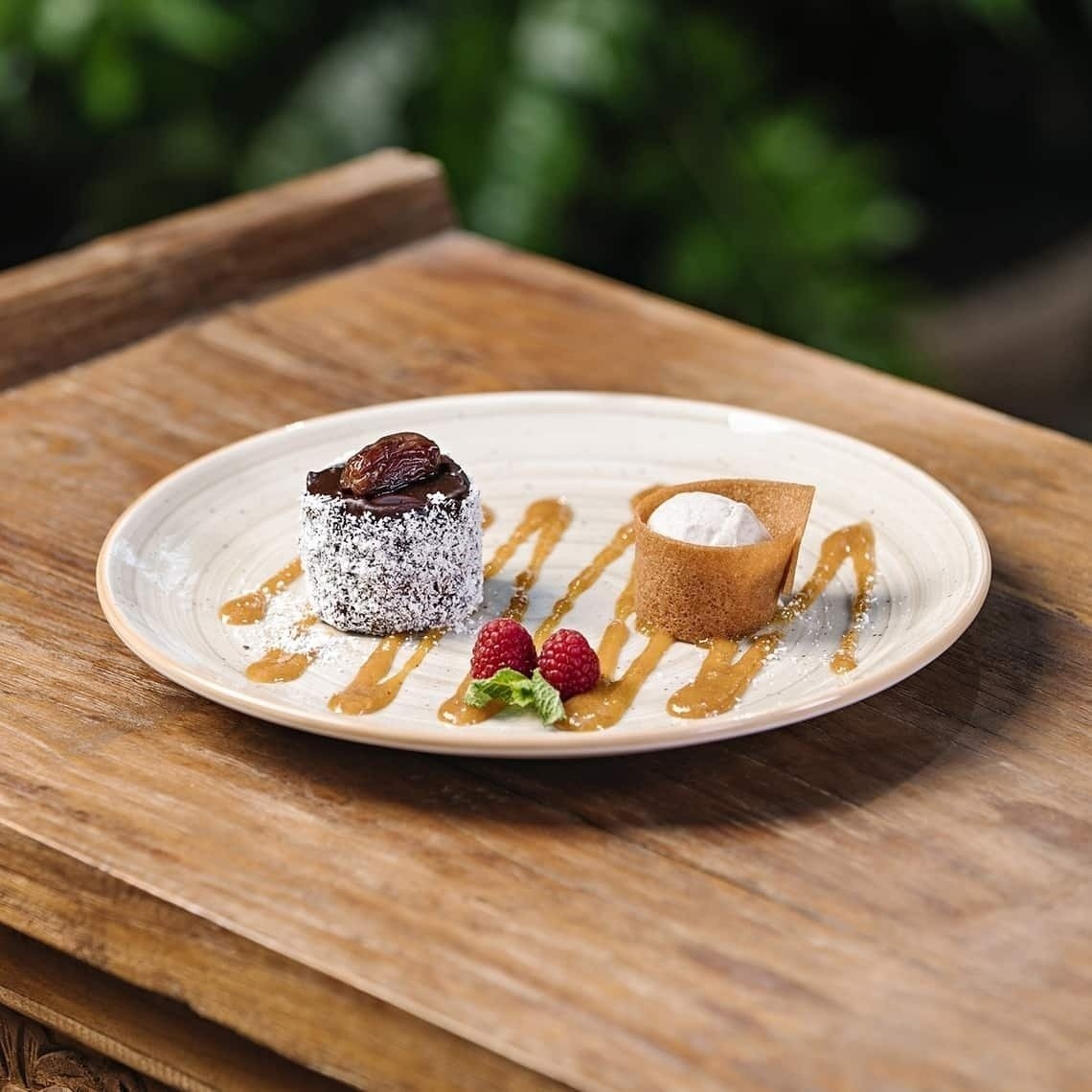 a white plate with a dessert on it on a wooden table