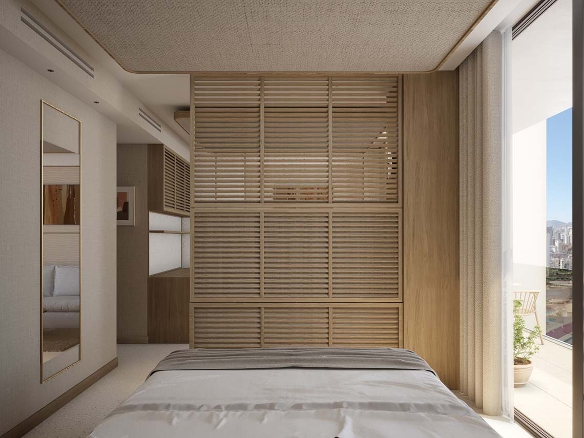 una habitación con una cama y una pared de madera