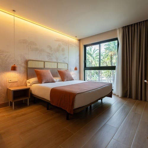 a hotel room with a large bed and a large window