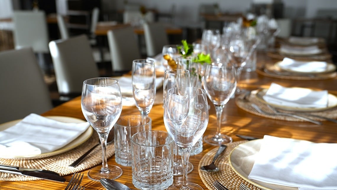 a table is set with plates glasses and silverware