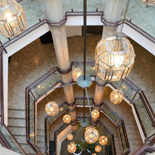 a staircase with a lot of lights hanging from the ceiling