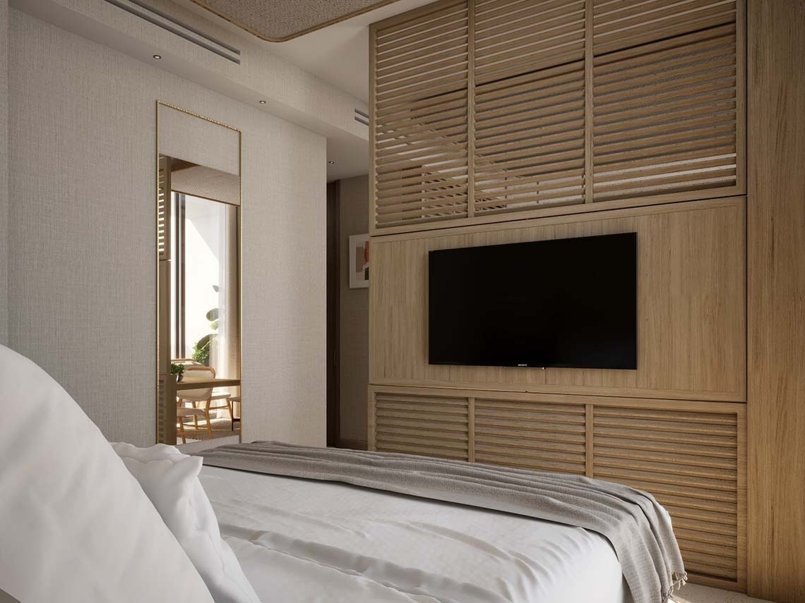 un dormitorio con una cama y una televisión sony