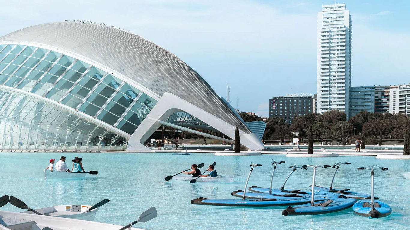 a group of people are paddling kayaks in a large body of water