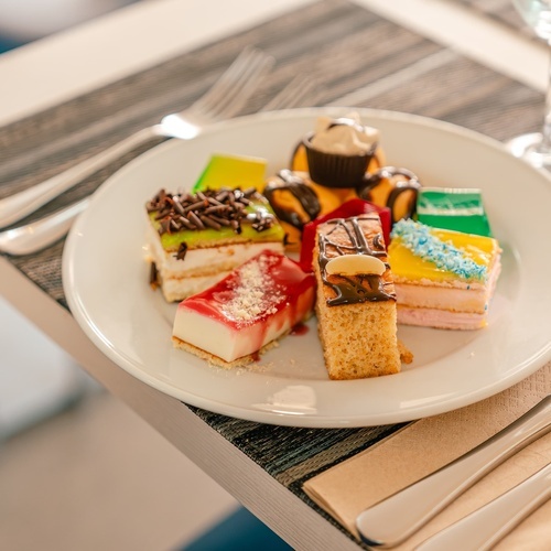 a white plate with a variety of desserts on it