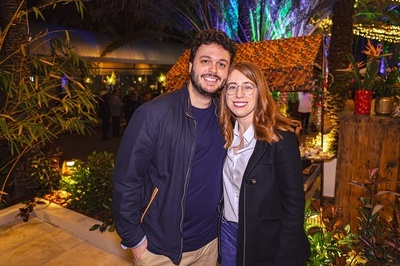 a man and a woman are posing for a picture - 