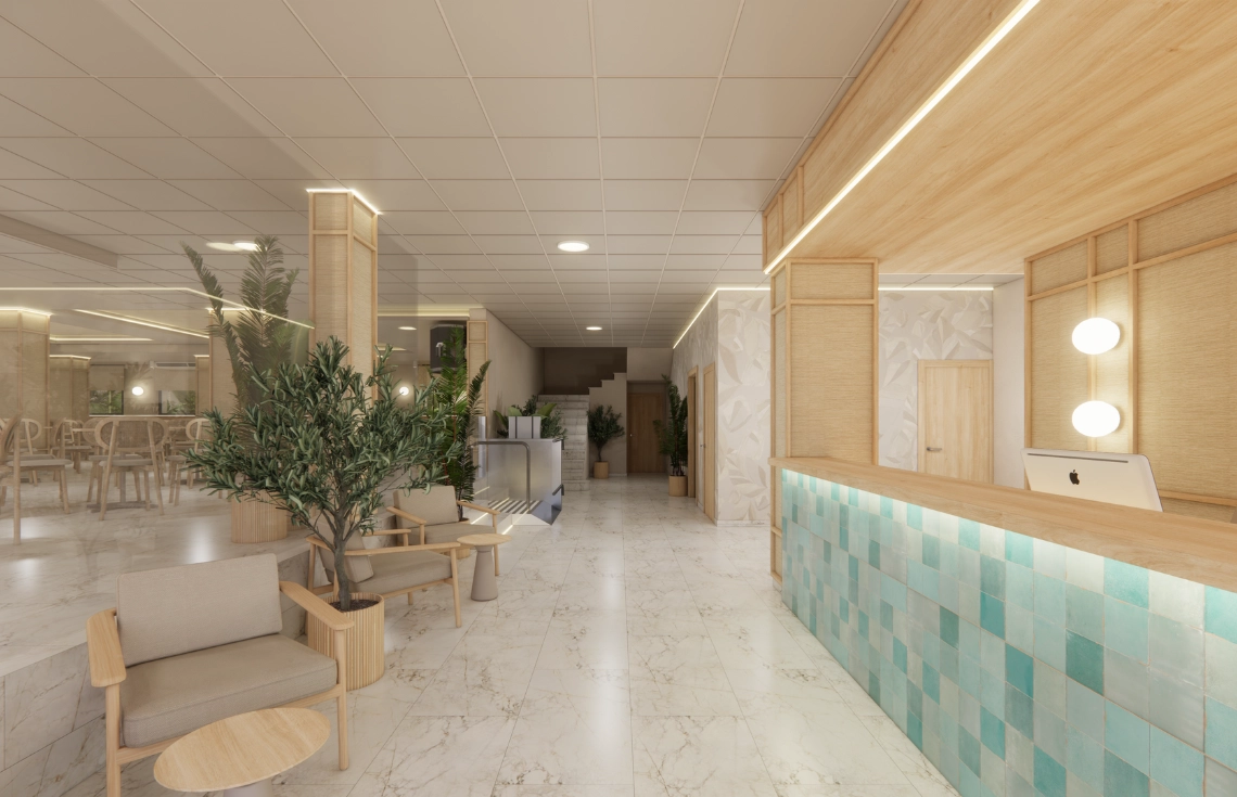 Recepción de hotel con diseño moderno, plantas y luz cálida. Port Hotels ideal para relajarse.