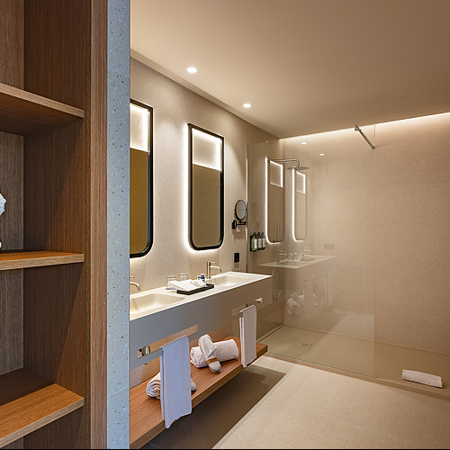 Baño moderno con doble lavabo, ducha y Port Hotels: Corporativa de lujo, toallas blancas dobladas.