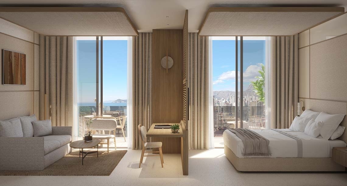 una habitación de hotel con una cama y un escritorio