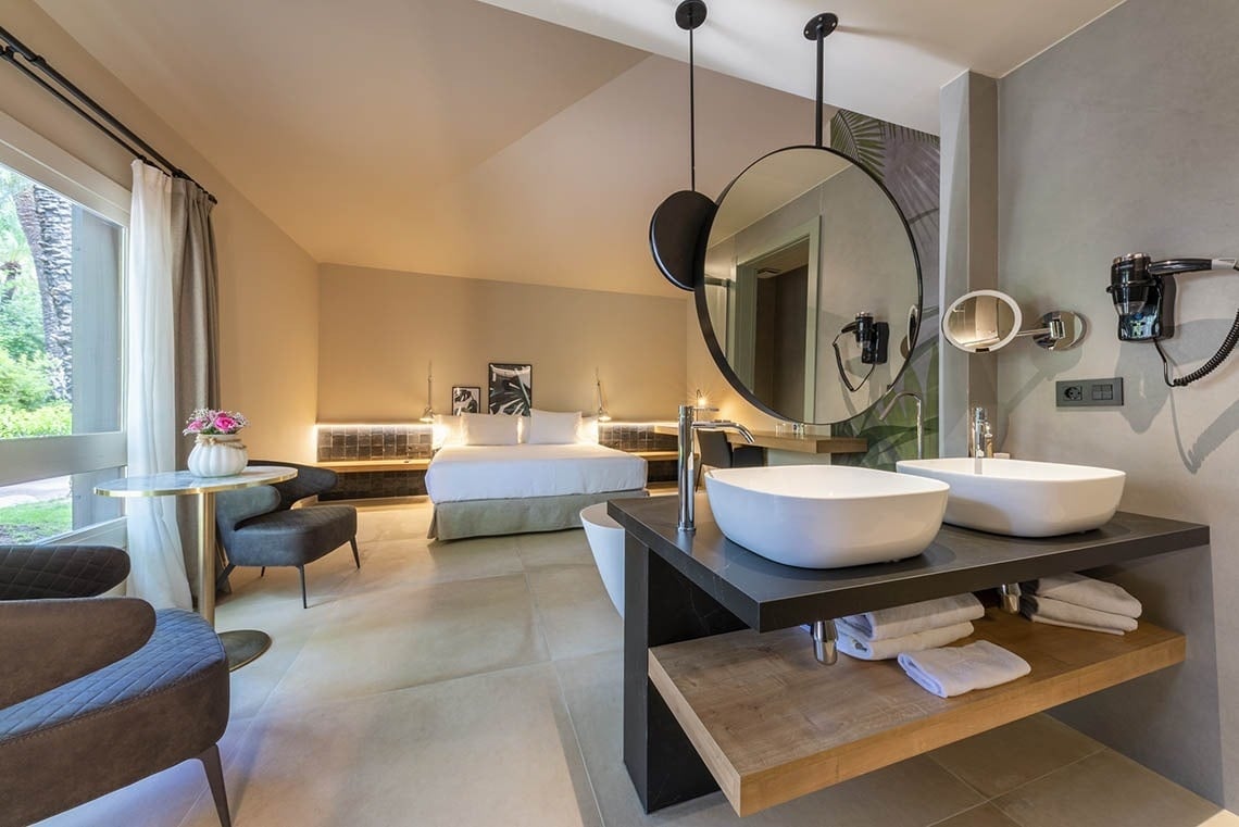 a bathroom with two sinks and a large mirror