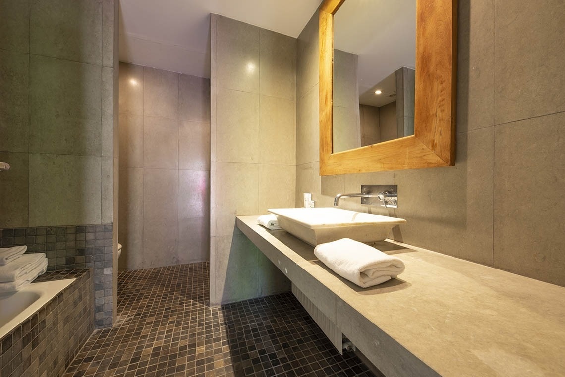 a bathroom with a sink and a large mirror