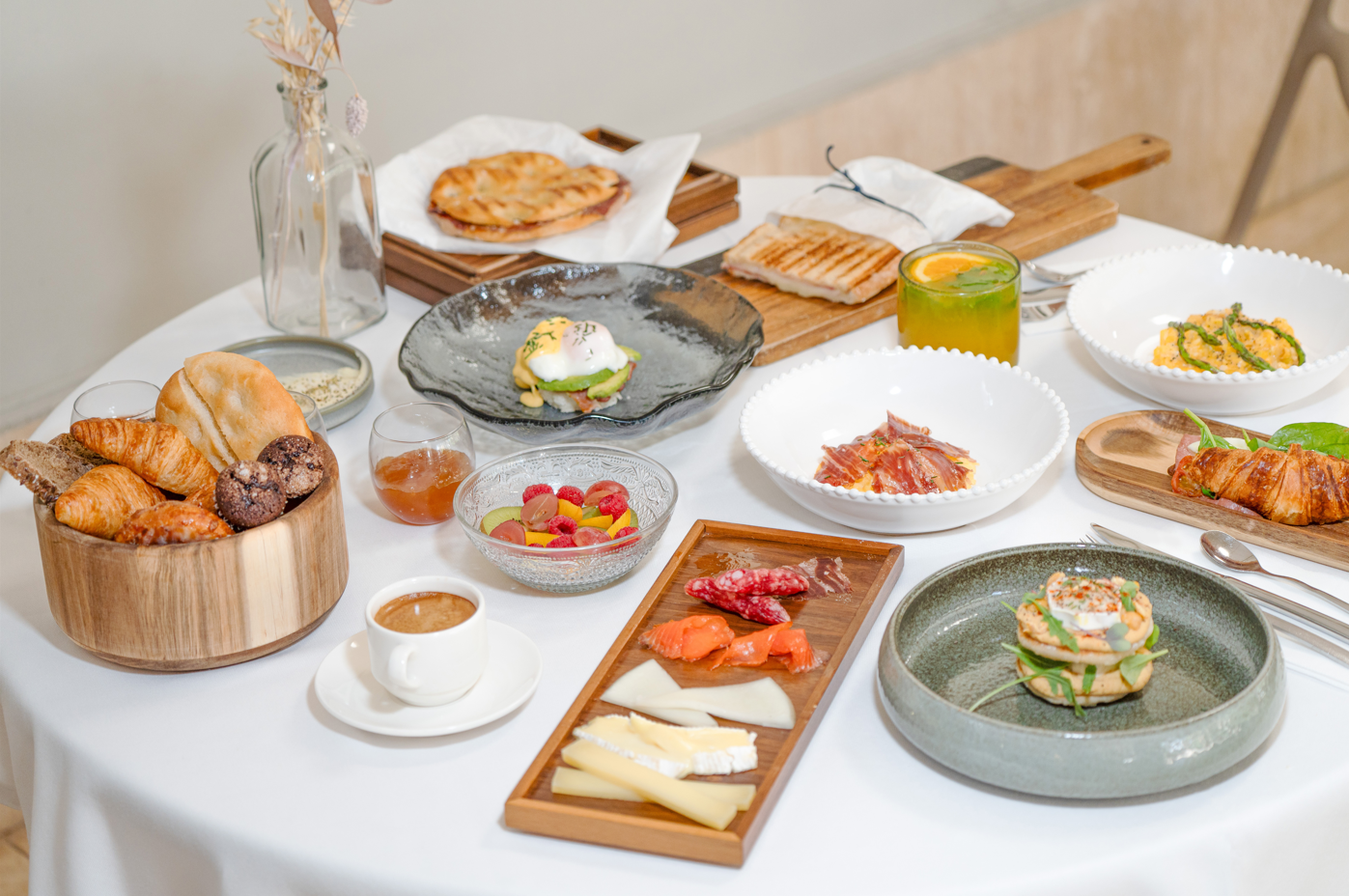 a table topped with a variety of food and drinks