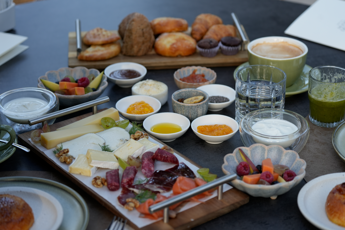 a table topped with a variety of food and drinks