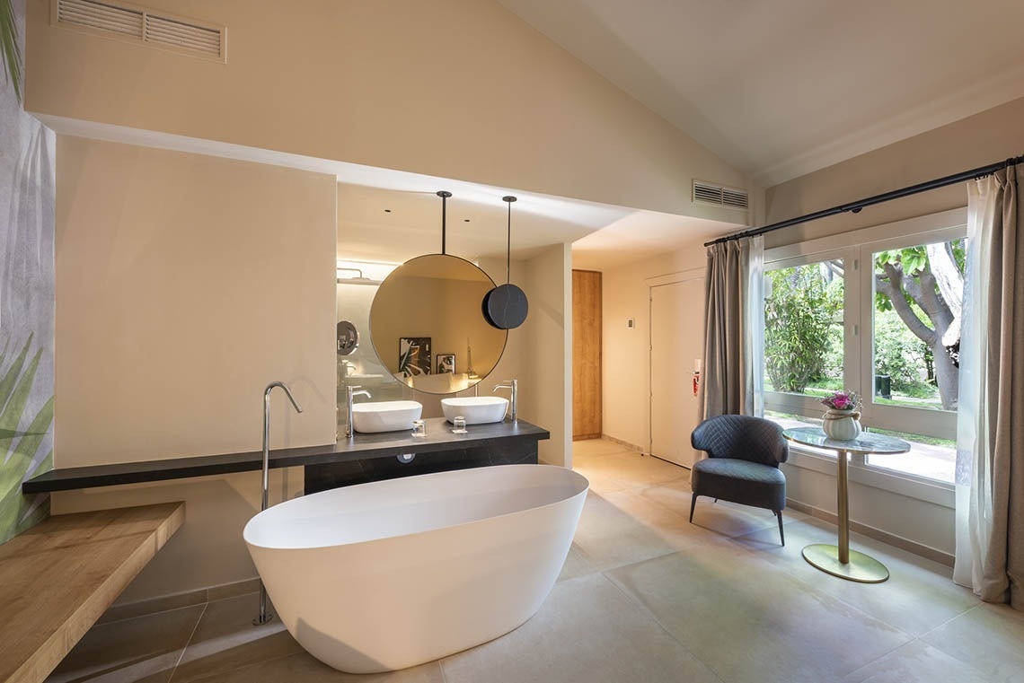 a bathroom with two sinks and a bathtub