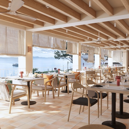 une salle à manger avec des tables et des chaises avec vue sur l' océan