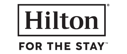 o logotipo do hotel hilton para a estadia está em um fundo preto .