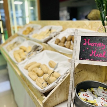 a display of food with a sign that says honey miel
