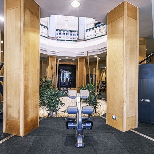 a gym with a treadmill and a machine that says nautilus on it