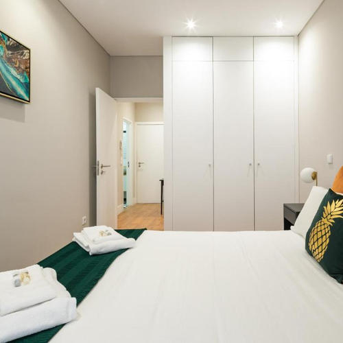 a bedroom with a pineapple pillow on the bed