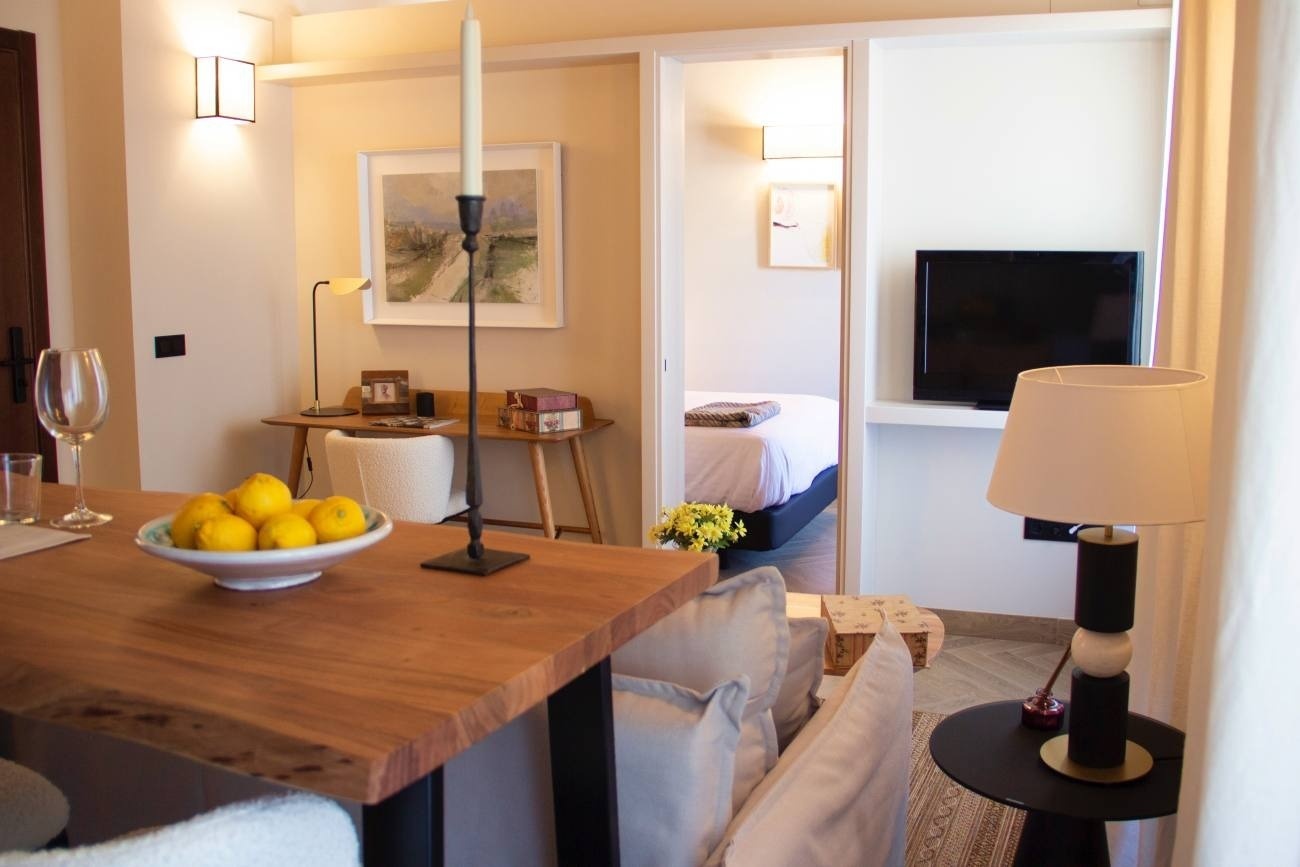 a bowl of lemons sits on a table in a living room