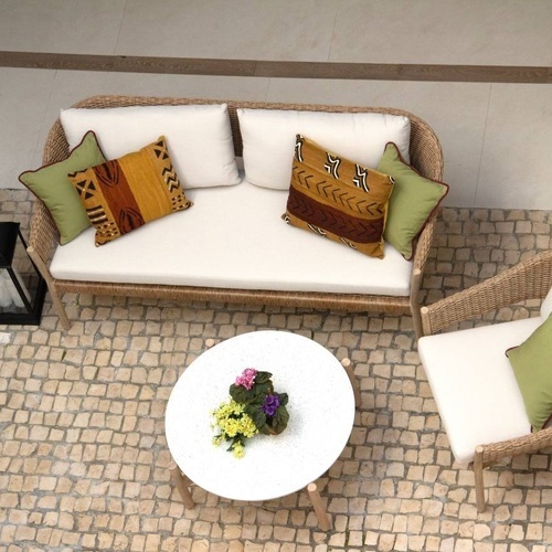 an aerial view of a patio with a couch and chairs