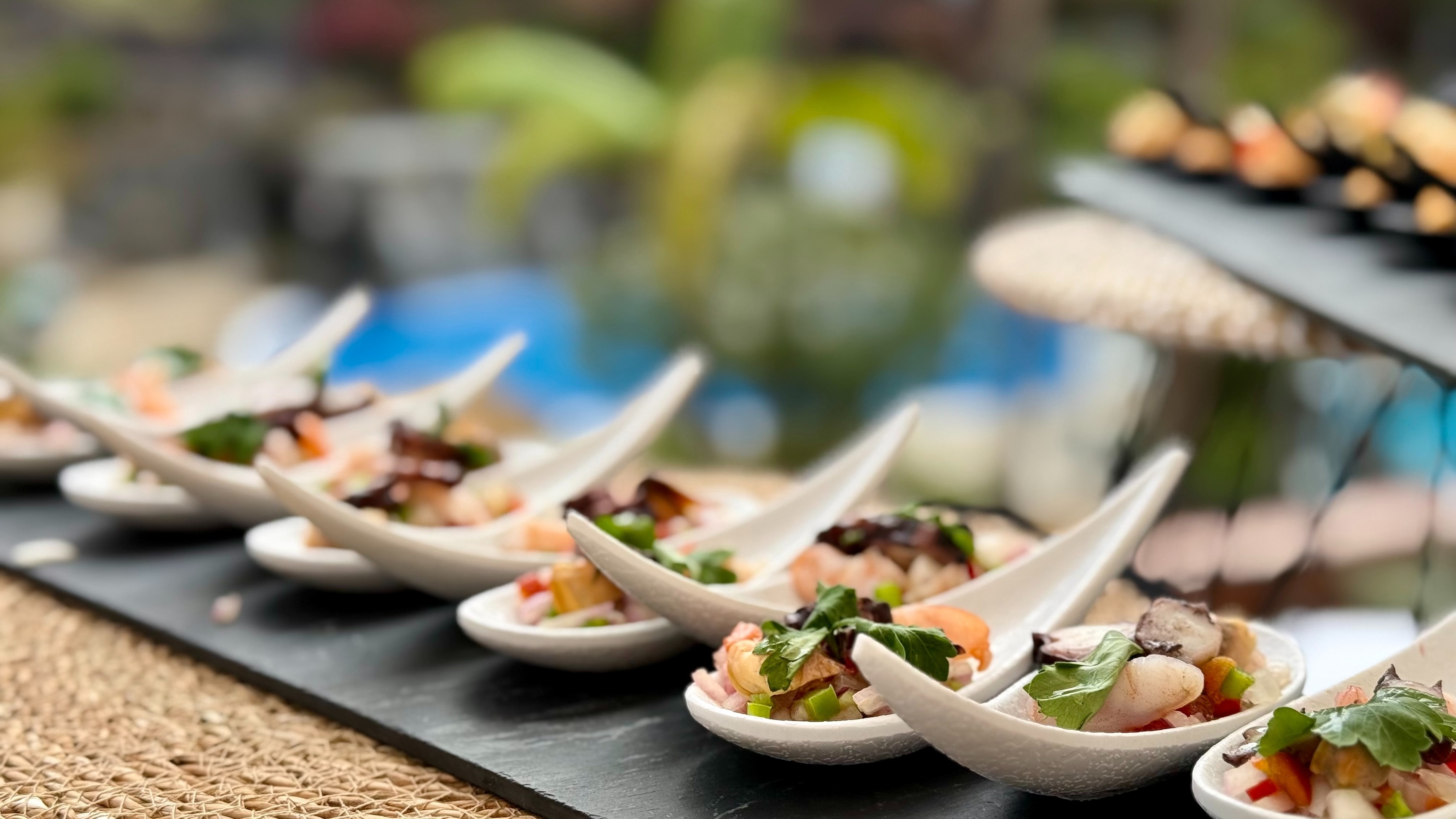 a variety of appetizers and salads in glasses on a table
