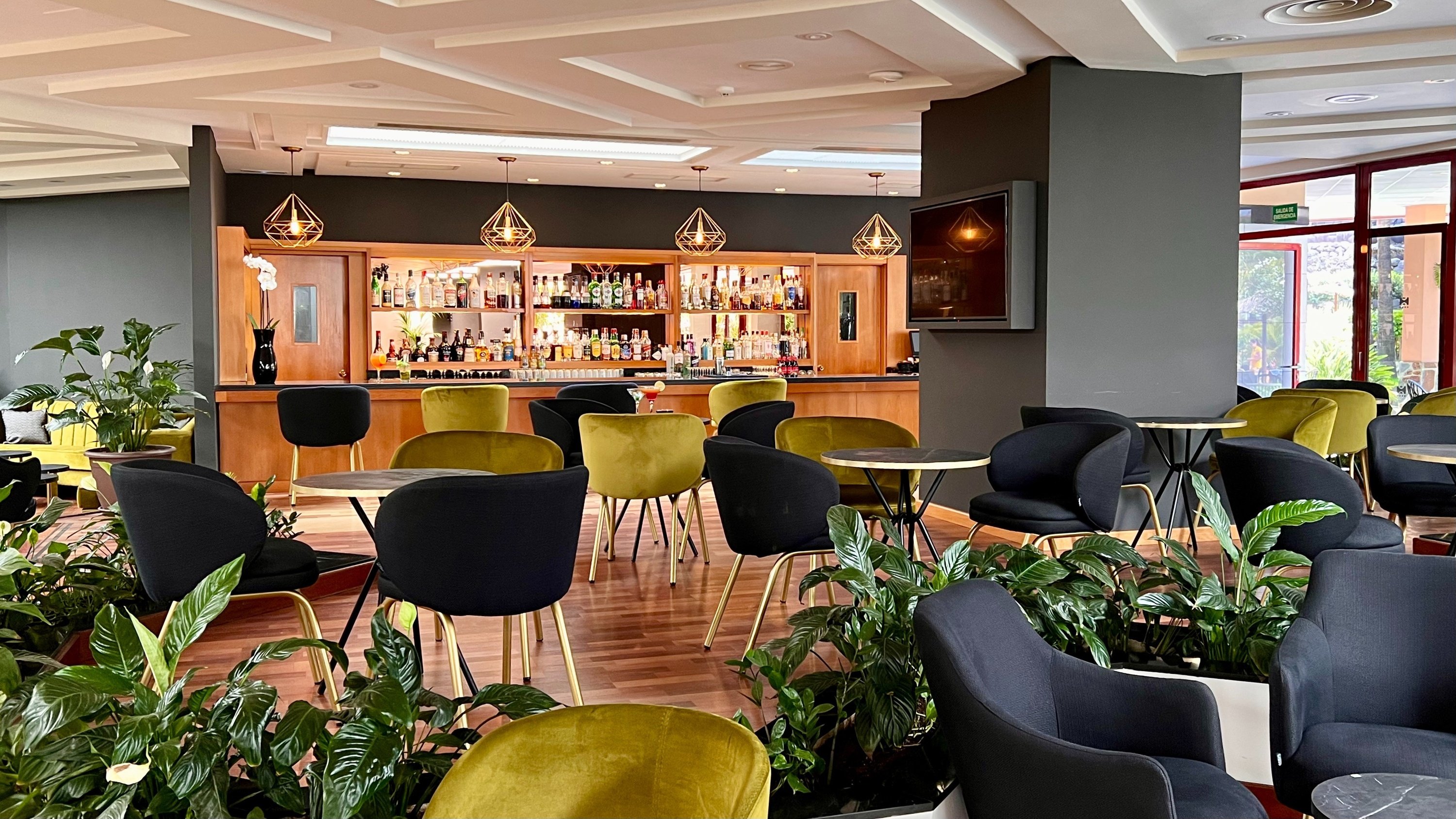 a dining room with tables and chairs set for a meal