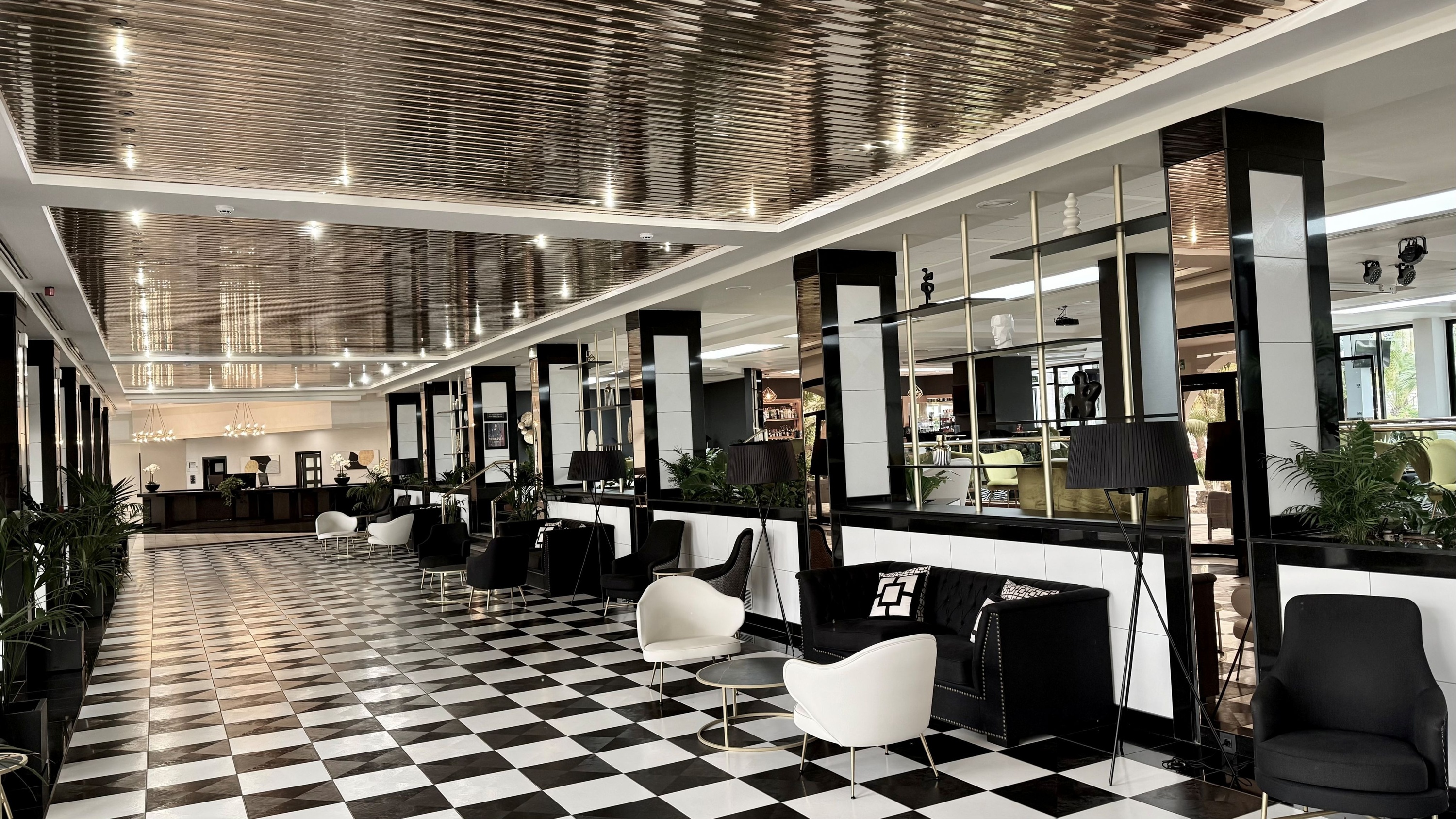 a black and white checkered floor in a hotel lobby