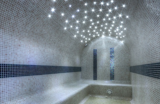 a room with a lot of lights on the ceiling