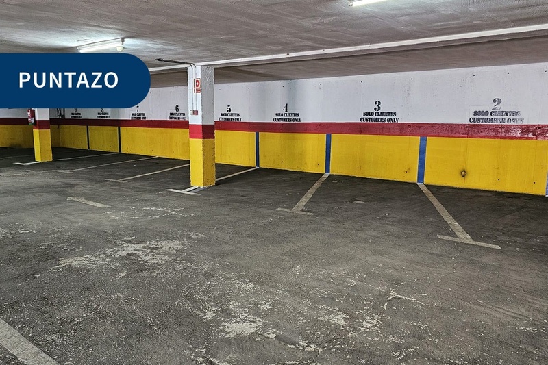 a parking garage with a sign that says puntazo