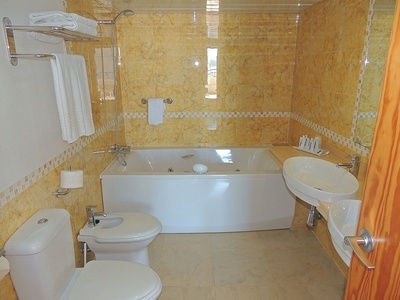 a bathroom with a bathtub toilet and sink