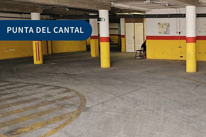 an empty parking garage with a sign that says punta del cantal